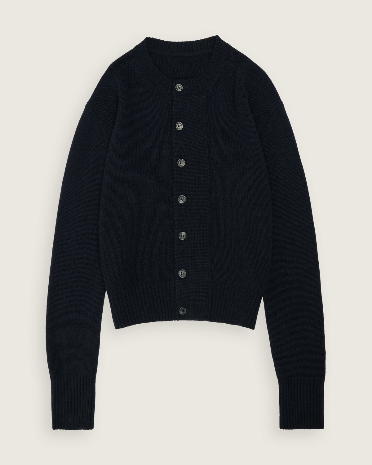 flat lay of the navy cropped cardigan