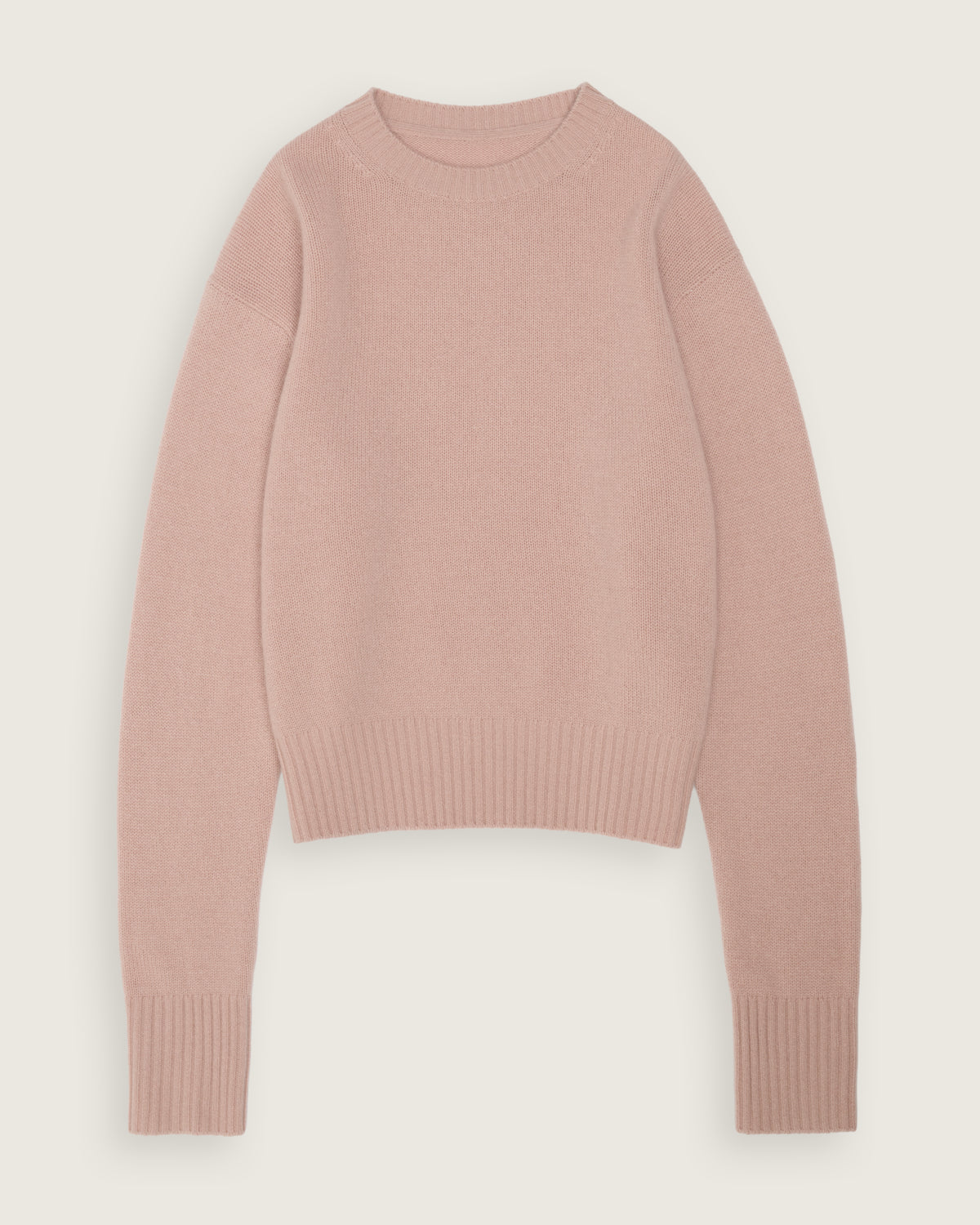 flat lay of the blush pink cropped sweater