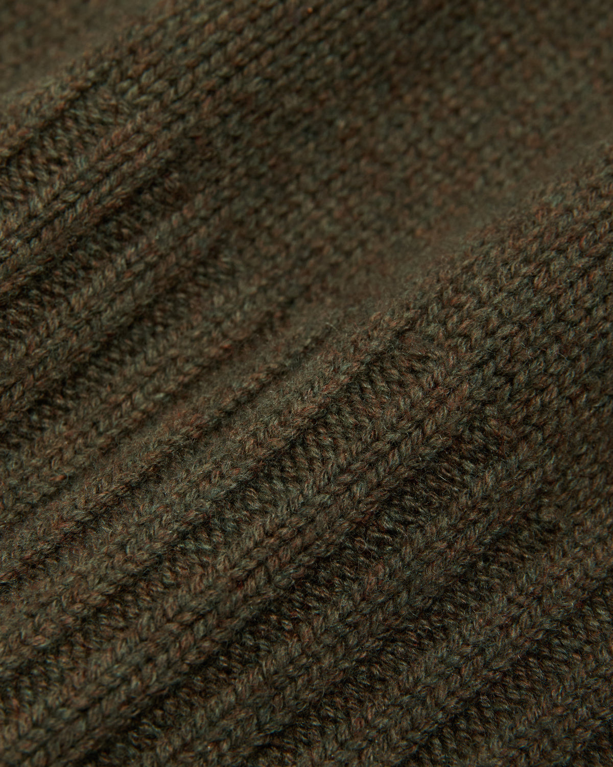 close-up of the olive ribbed knit fabric