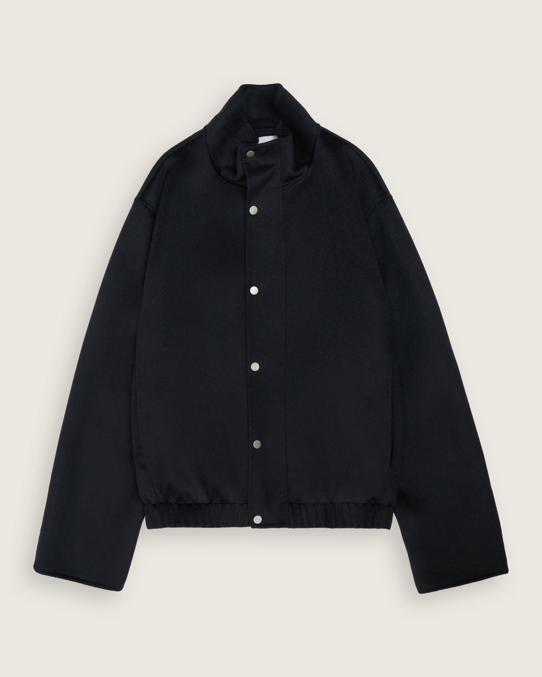 flat lay of the dark navy cropped bomber