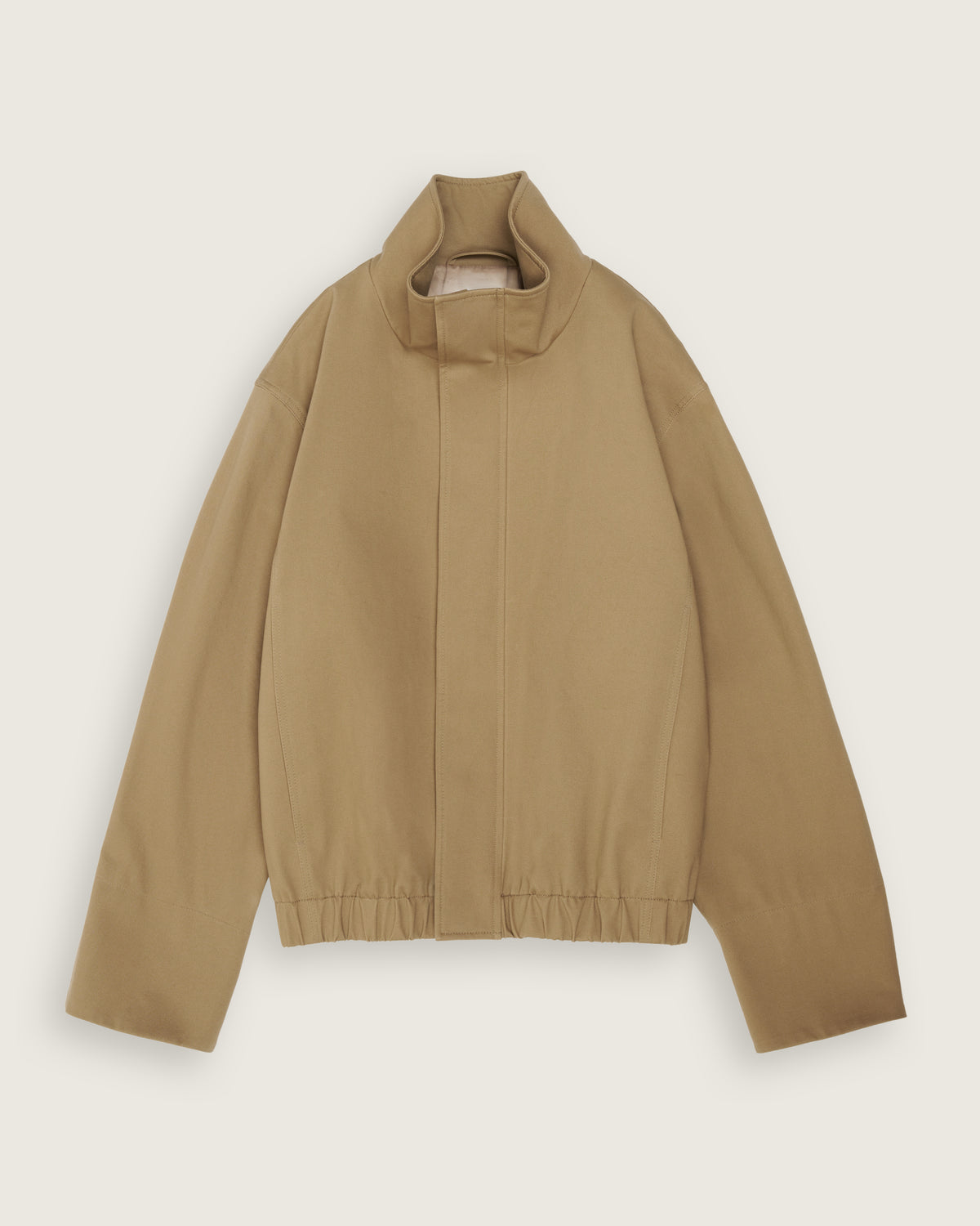 flat lay of the sand cropped cotton bomber
