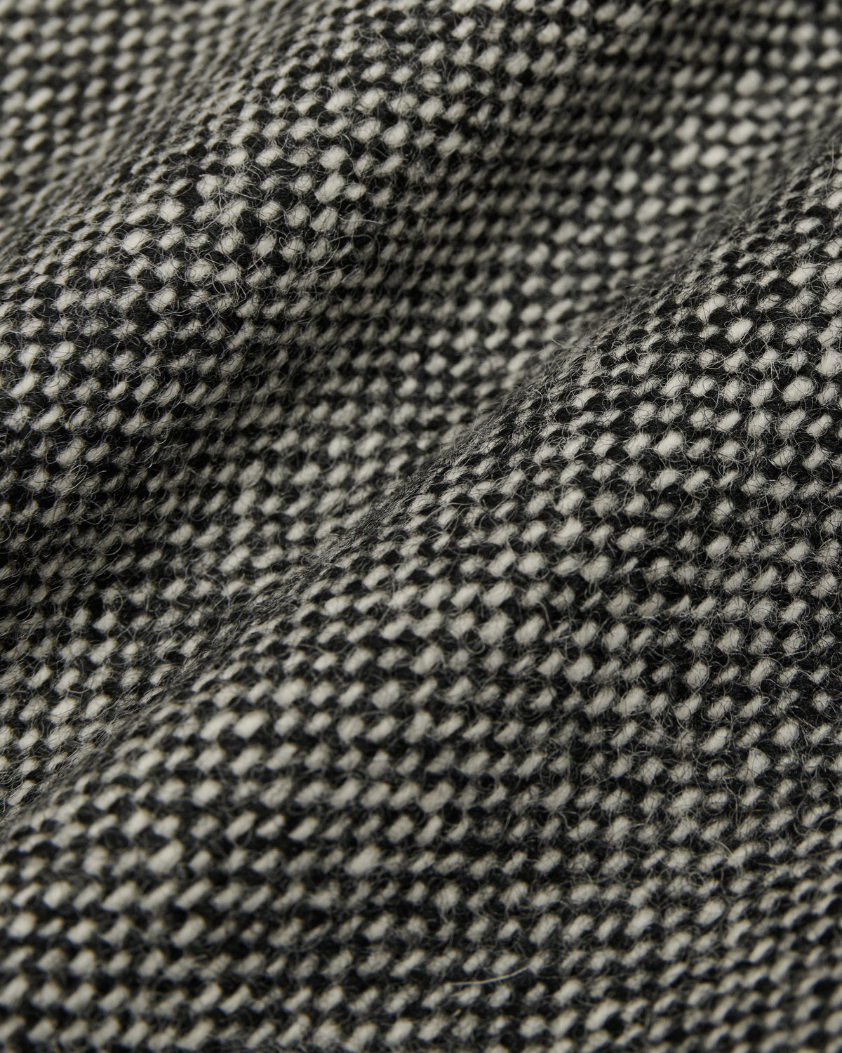 close-up of the black and white tweed skirt fabric