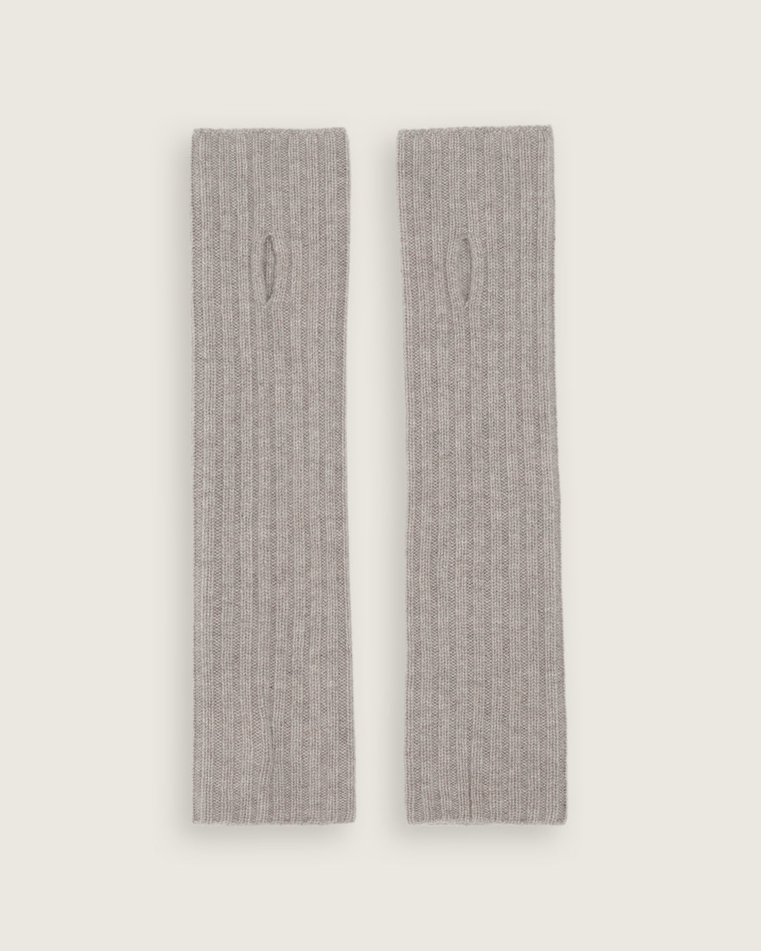 flat lay of the natural ribbed fingerless gloves
