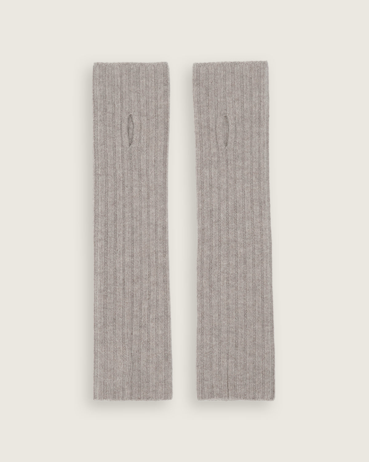 flat lay of the natural ribbed fingerless gloves