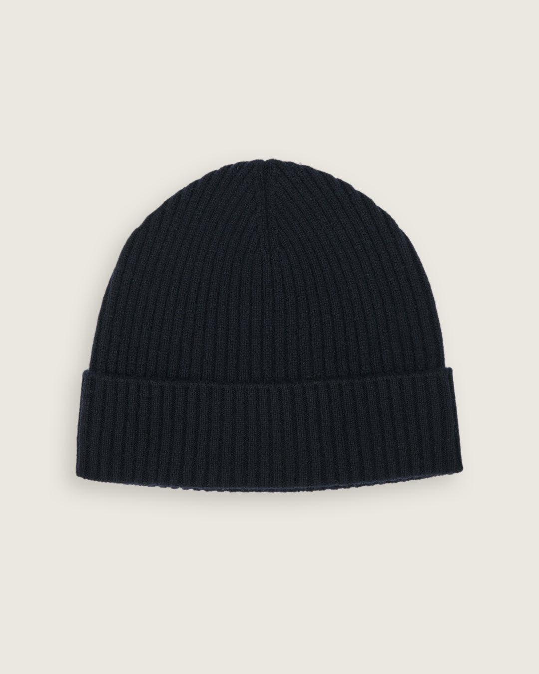 flat lay of the natural knitted rib beanie