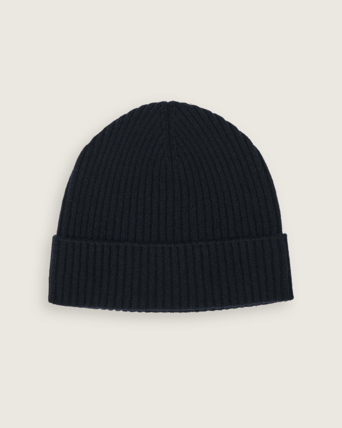 flat lay of the natural knitted rib beanie