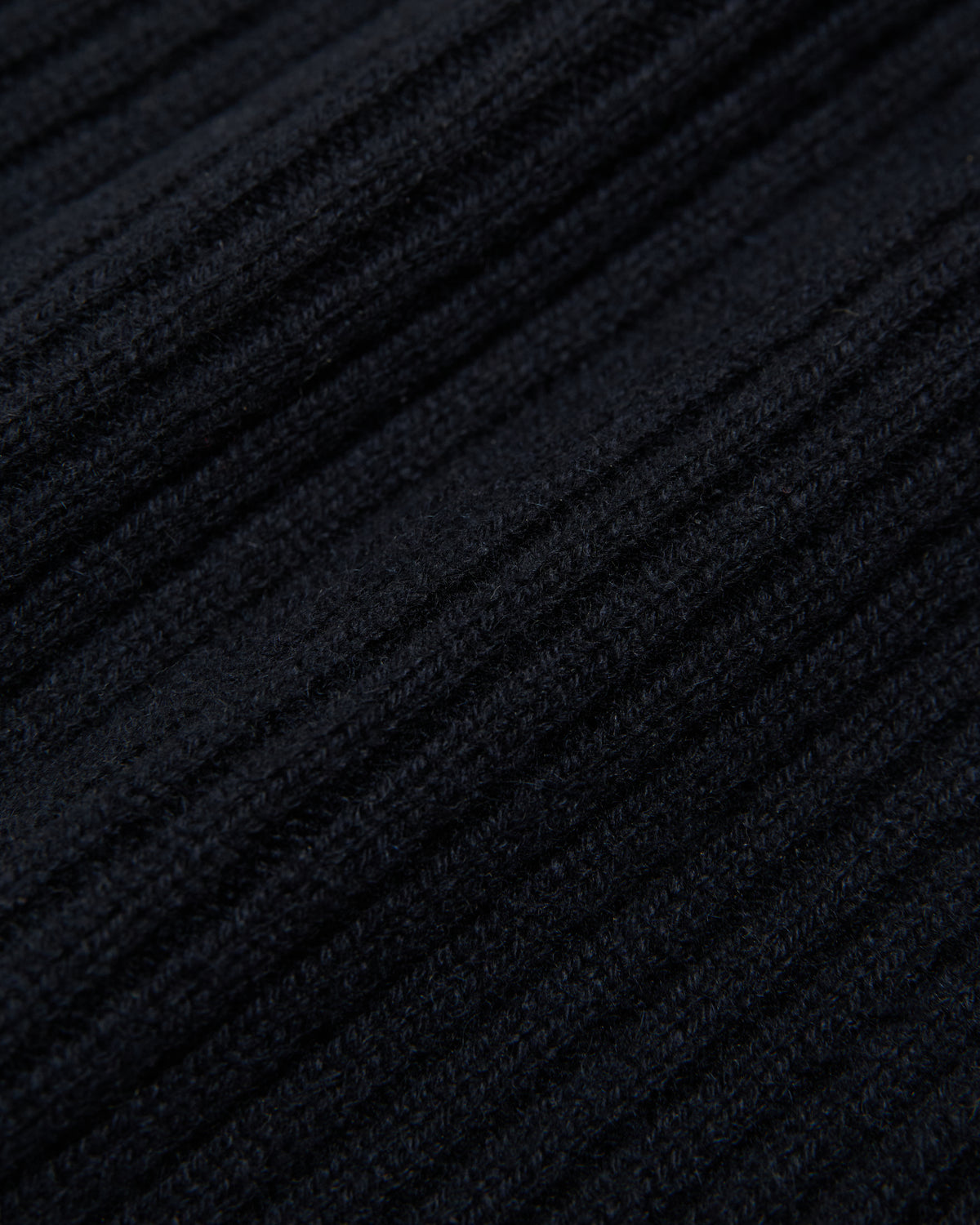close-up of the navy ribbed cashmere knit fabric