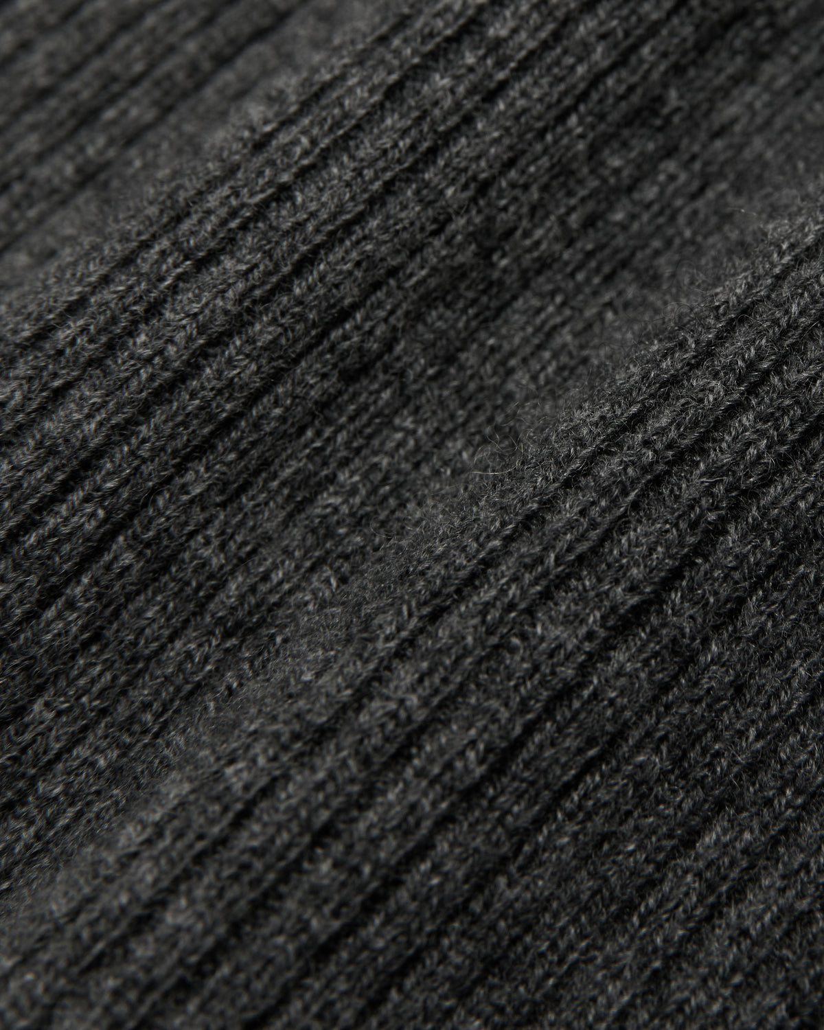close-up of the charcoal grey racer vest knit fabric
