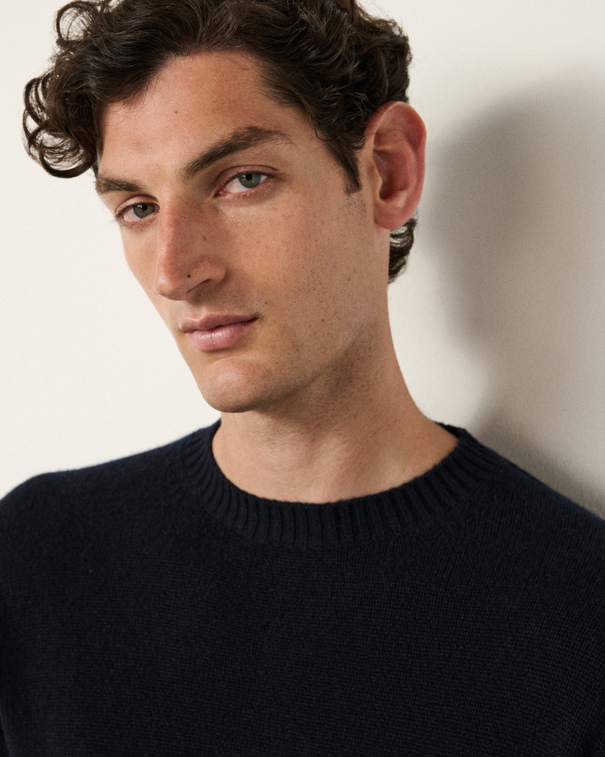 close-up of man's face, midnight navy sweater