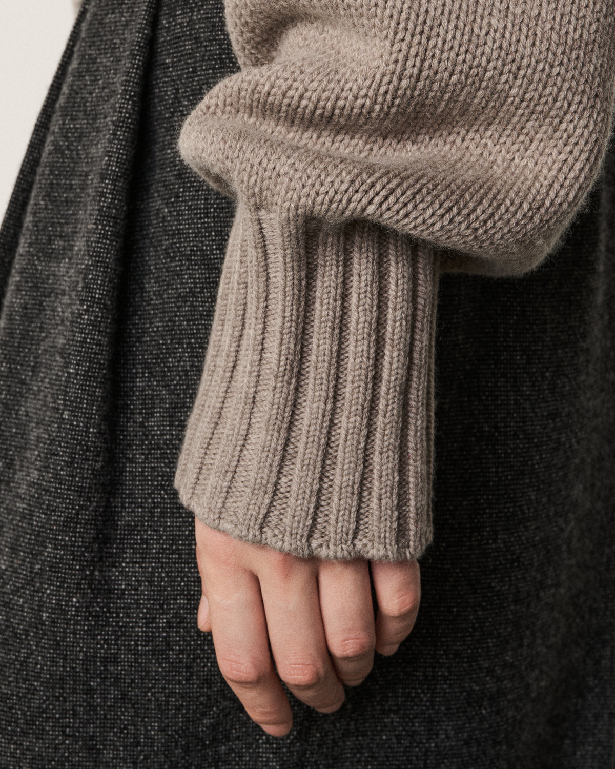 close-up of a hand on the mink sweater cuff