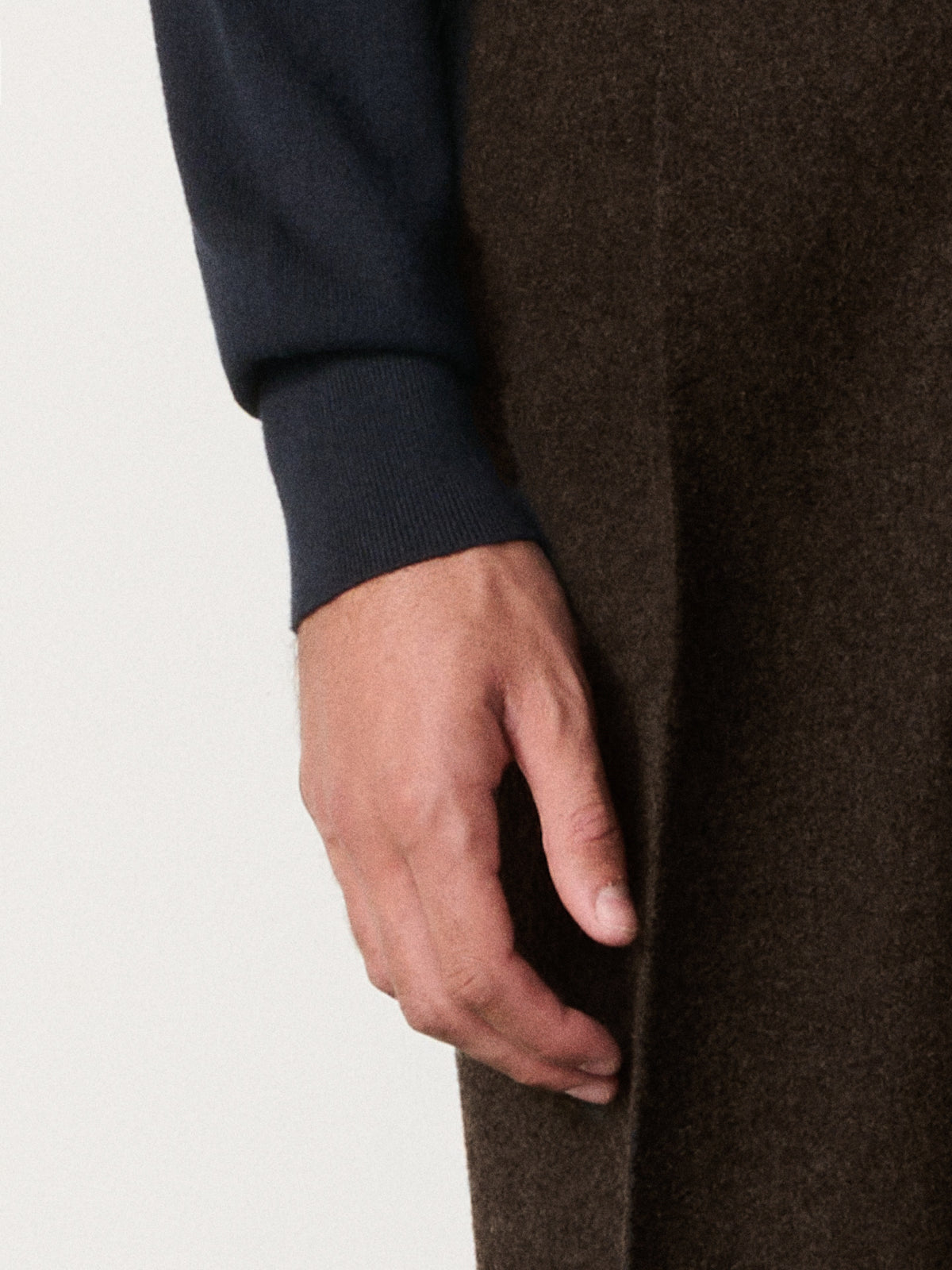close-up of a hand on the sweatshirt sleeve