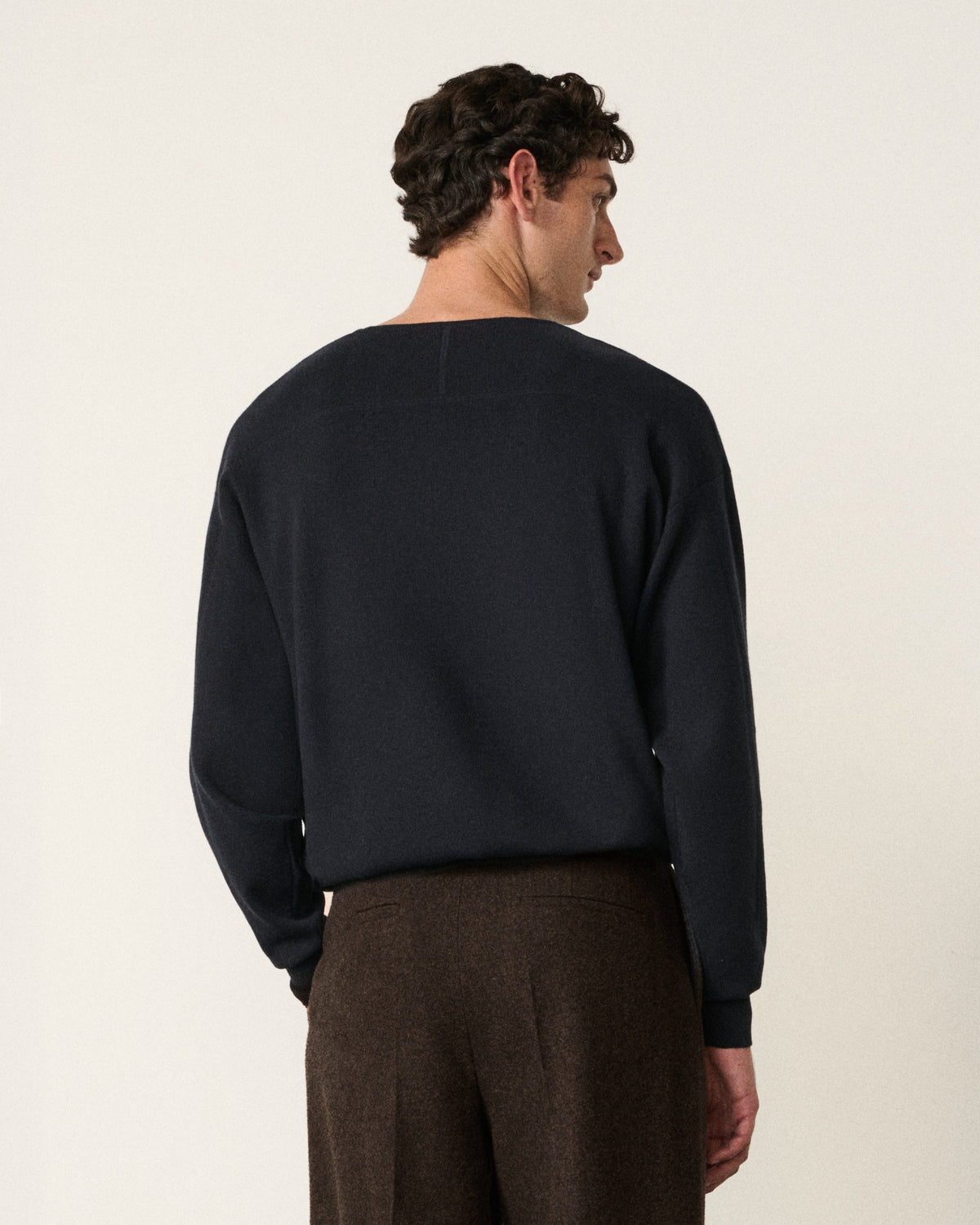 man in the indigo sweatshirt, back view