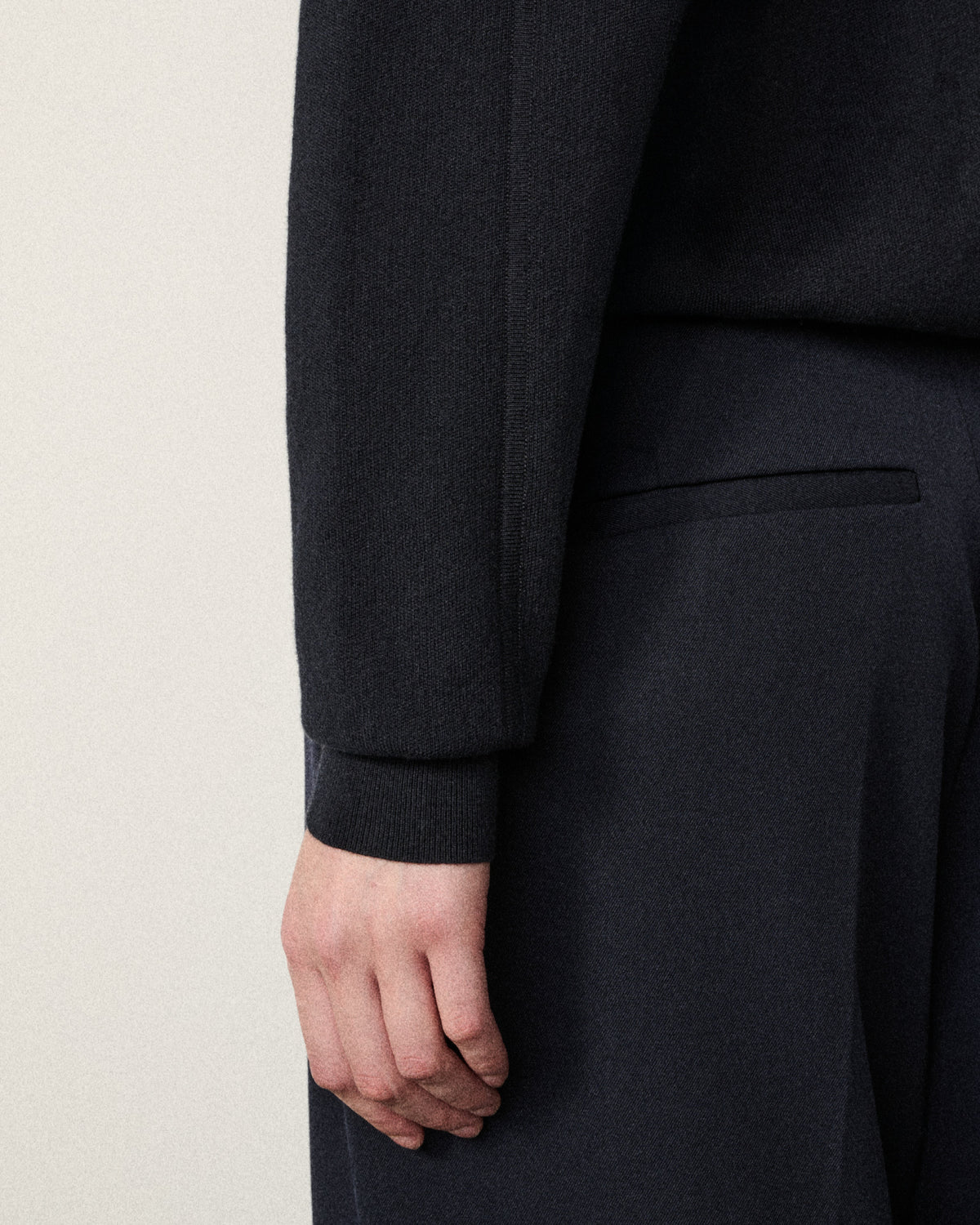 close-up of a hand on the sweatshirt sleeve