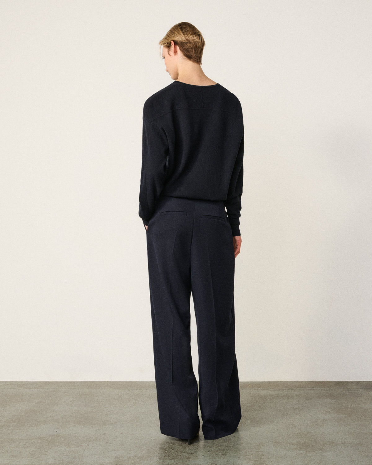 woman in the indigo sweatshirt, back view