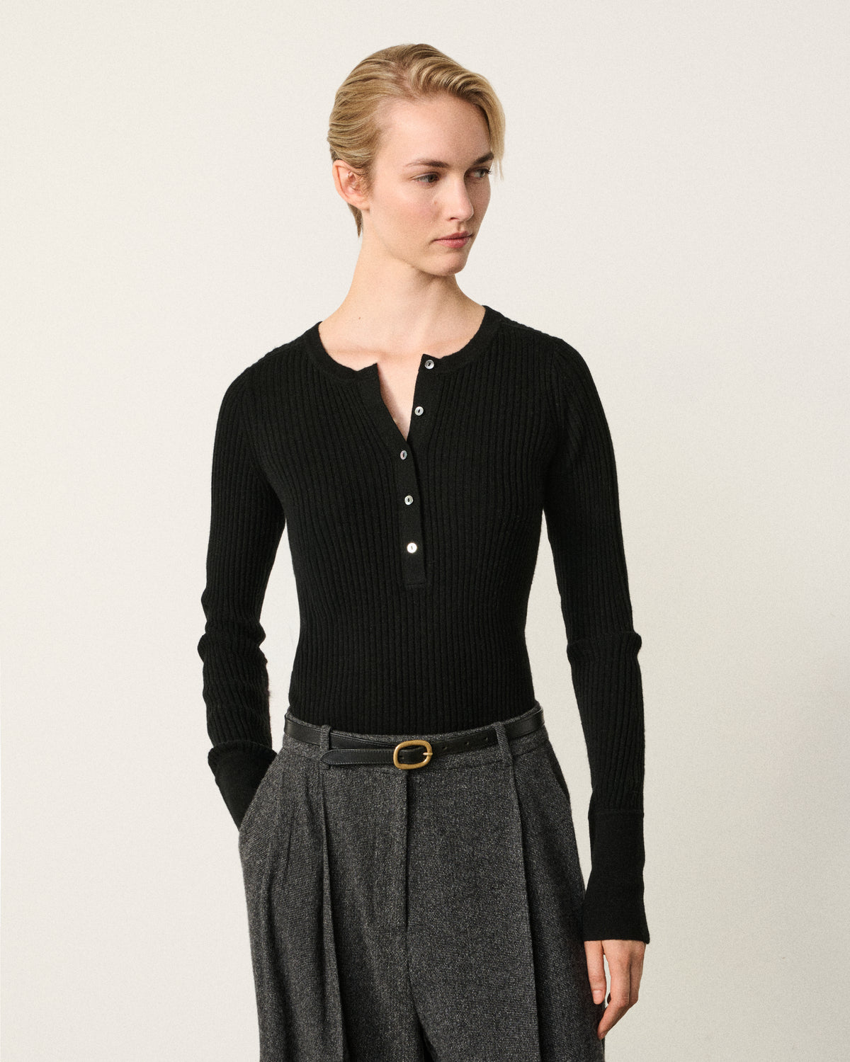 woman wearing the black ribbed henley top