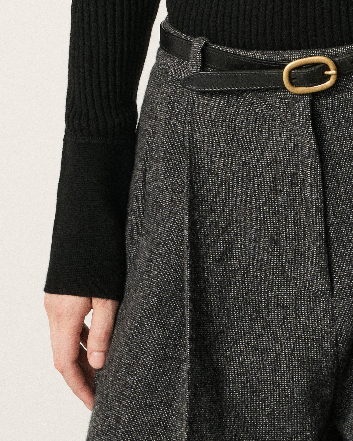 close-up of a belt on the henley top and skirt