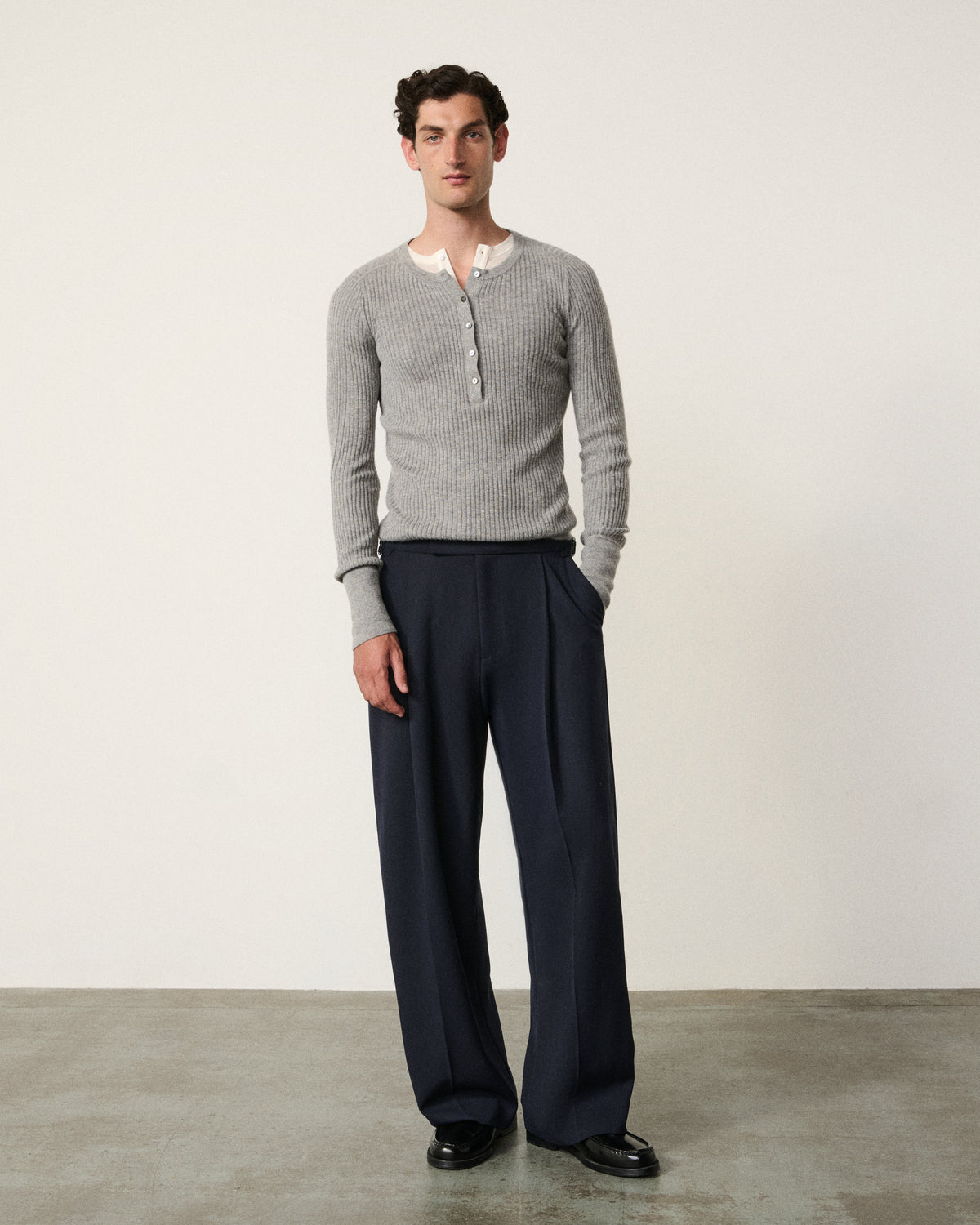 man in the navy everyday tailored pant, grey henley, front view