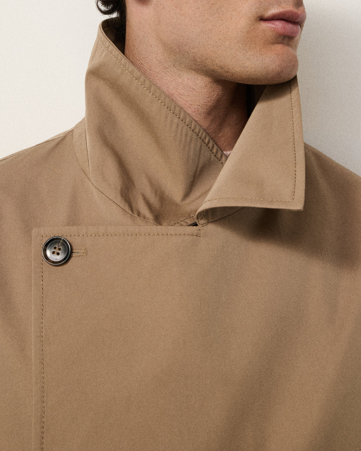 close-up of a man's collar on the sand trench coat