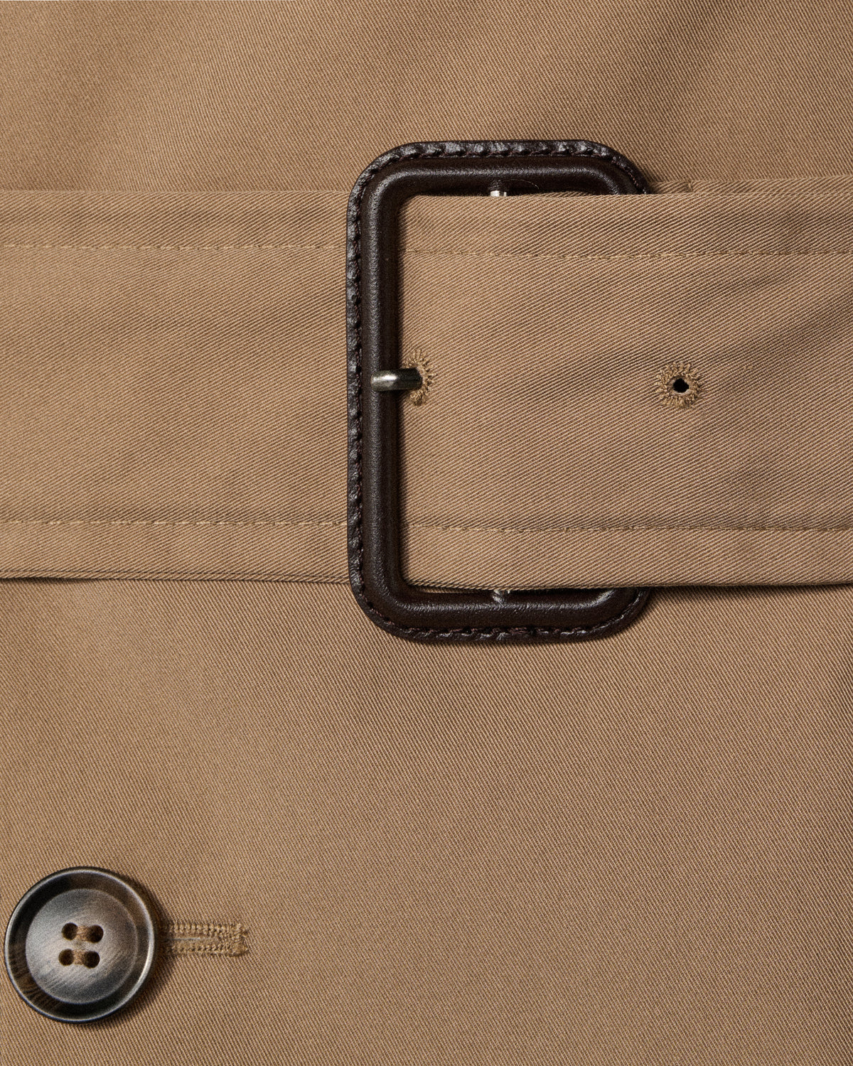close-up of the trench coat's belt buckle