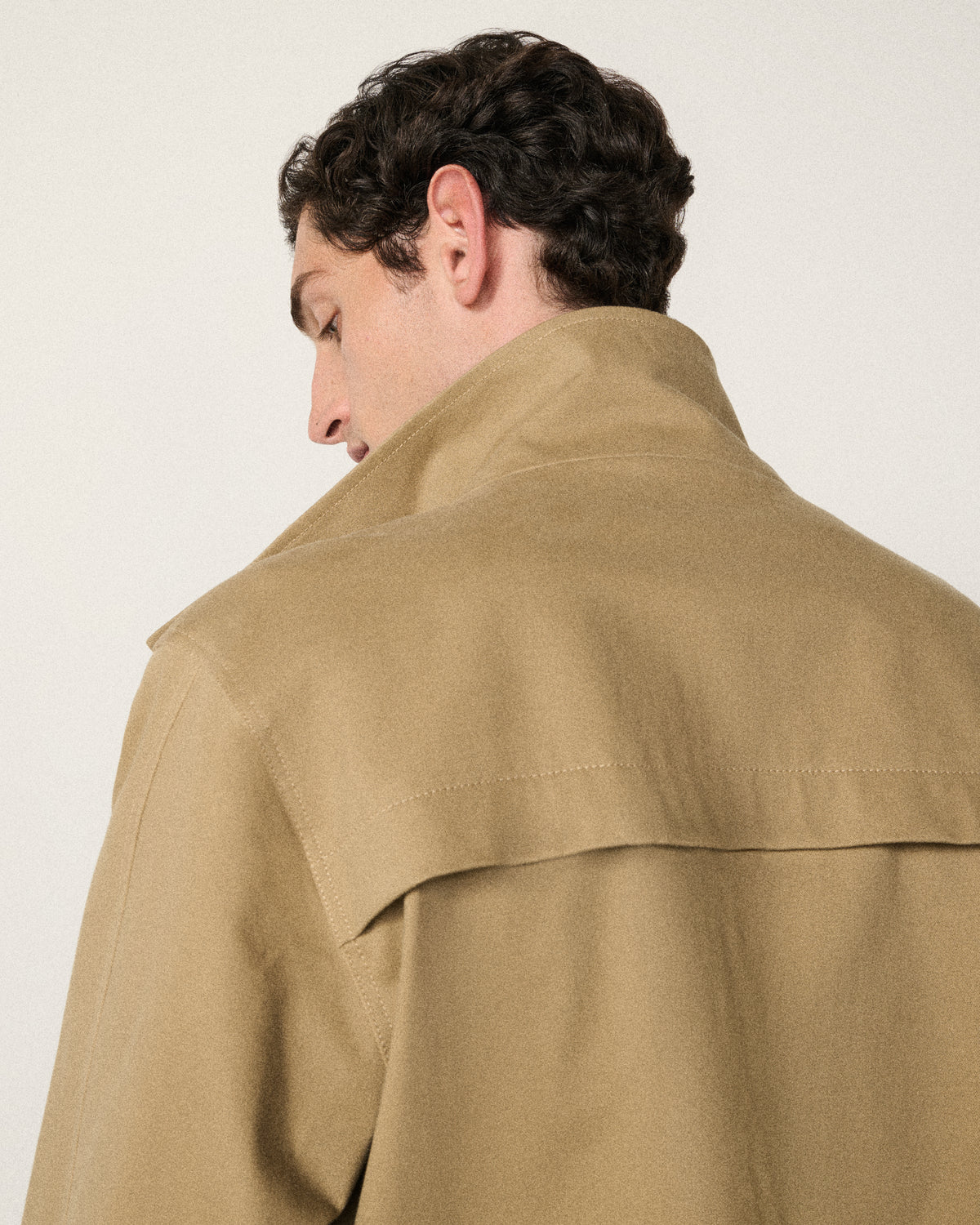 close-up of a man's neck and the sand bomber collar, back view