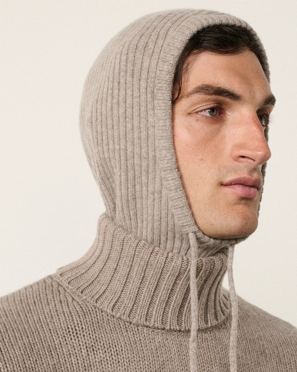 man wearing the natural ribbed cashmere snood hood