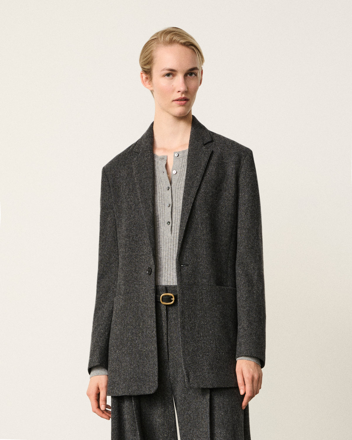 woman wearing the dark grey wool blazer