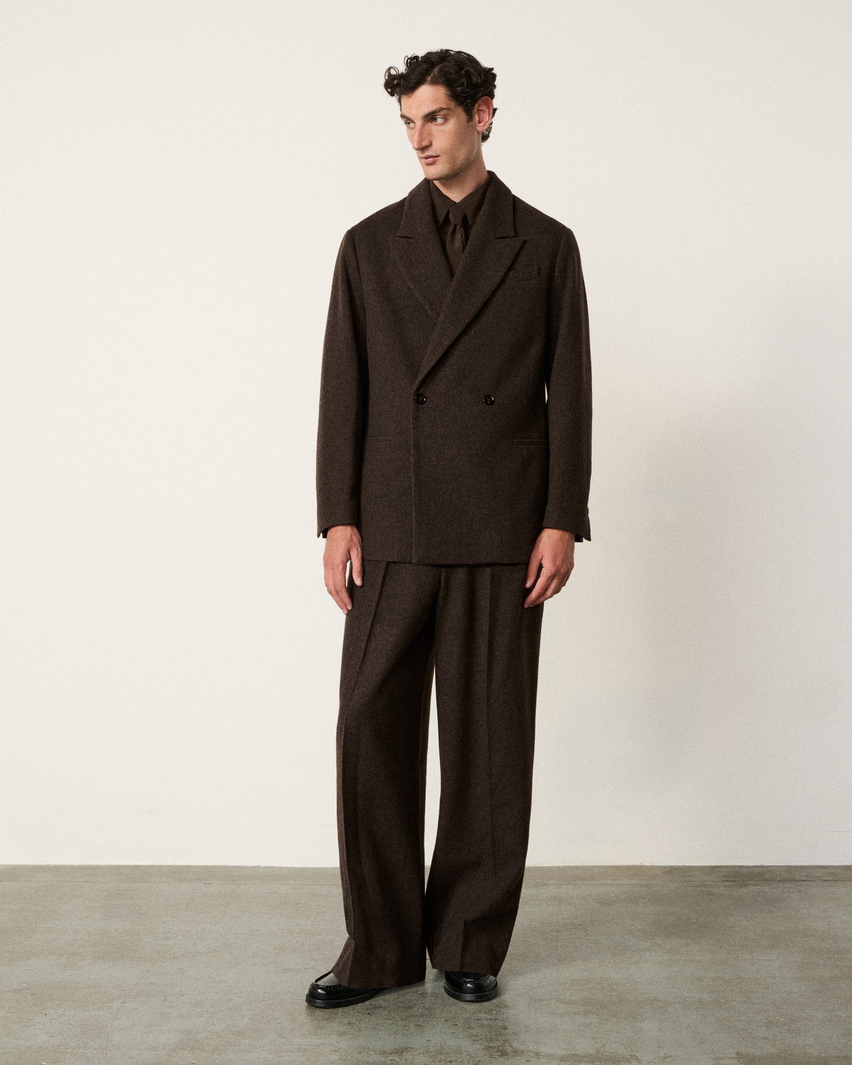 man wearing the chocolate brown un-structured blazer