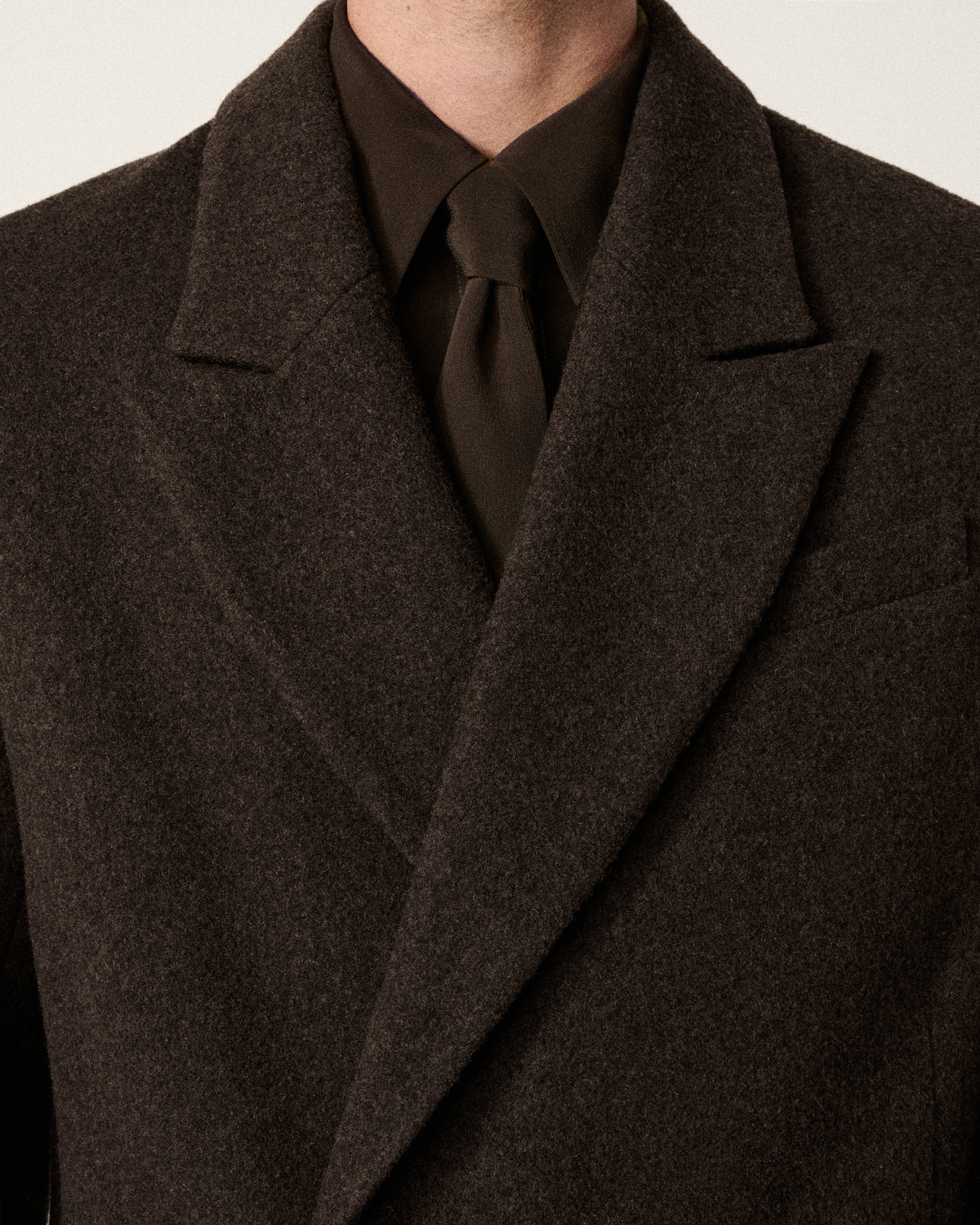 close-up of collar and tie detail on jacket