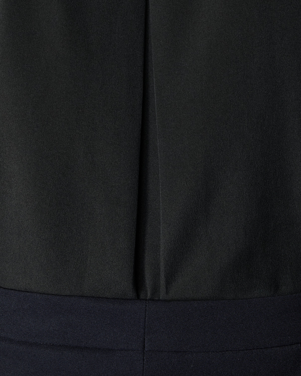 close-up of the black tux shirt pleat detail