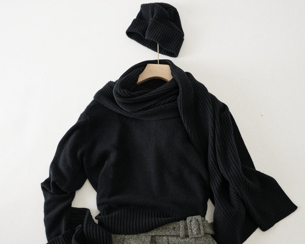 styled flat lay with scarf and beanie