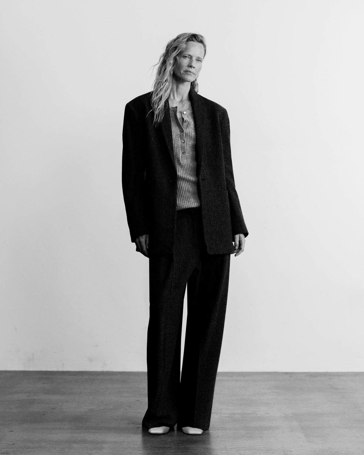 woman in wide leg pant and blazer, black and white